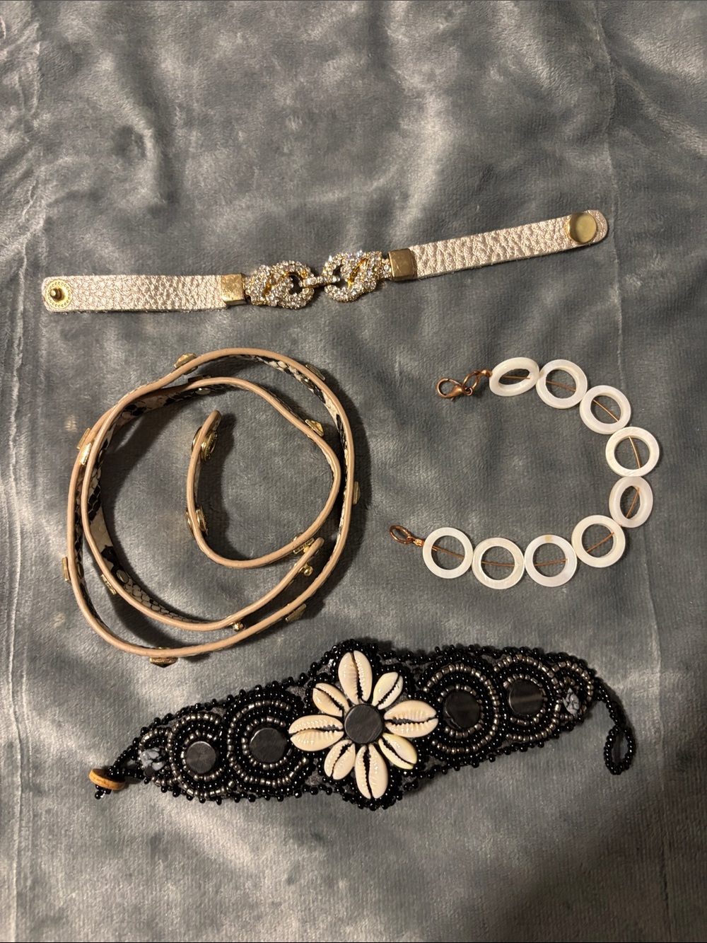 Set of Four Fashion Bracelets in Black, White, and Beige